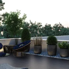 A relaxing corner on the terrace with comfortable seating and a variety of potted plants, offering a peaceful view of the surrounding greenery.