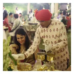 Our service is defined by grace and attention to detail. Here, a member of our professionally trained staff, attired in traditional uniform, provides personal table service at an elegant sit-down dinner, ensuring every guest feels exceptionally cared for.
