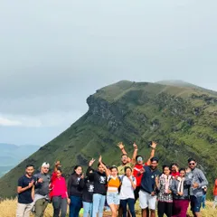 A happy group posing with the stunning backdrop of the Chikmagalur hills. The energy of our groups is always fantastic.