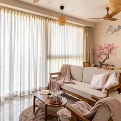 Another perspective of this tranquil living room, highlighting the soft textures and natural light that make the space feel warm and inviting.