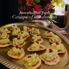 This is the canapé of our dreams: my Avocado Bhel Papdi. I top a crispy papdi with a zesty avocado mixture and pomegranate seeds, creating a fusion snack that combines the creaminess of guacamole with the crunch and tang of Indian street food.