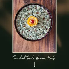 I believe food should be art. My Sun dried Tomato Hummus is piped into beautiful florets and garnished with an edible flower, making it a stunning centerpiece for any dip platter.