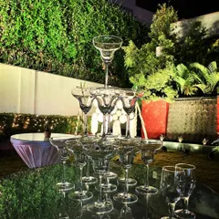It's not just for champagne. We also create margarita pyramids for a fun twist on the classic tower, perfect for sangeets and cocktail parties. This one is set up outdoors, ready for the party to begin.