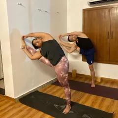Stretching after a workout is essential. Here, my students are working on standing splits and side bends to release their muscles after a cardio-intensive class.