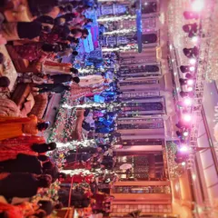 This top-down perspective of the wedding hall shows the energy and scale of the event. You can see all your guests celebrating, the intricate decor, and the vibrant lighting design.
