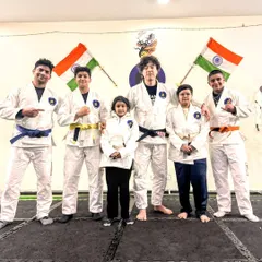 Our kids and youth students posing with a visiting BJJ black belt. It's important for them to see the path of progression and learn from experienced practitioners from around the world.