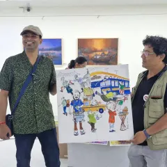 Presenting the finished artwork, now with color, at the Kolkata art exhibition.