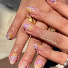 A soft and subtle design perfect for Holi. This look features a pastel ombre base with delicate, hand-drawn floral designs, celebrating the festival of colors in an elegant way.