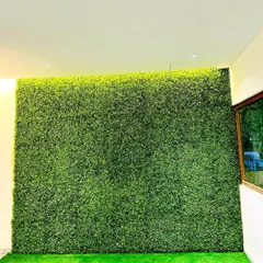 This large indoor vertical garden serves as a massive art piece. It completely transforms the feel of the room, providing a backdrop of lush greenery that requires zero upkeep.