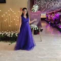 Dressed for an elegant engagement party. I always coordinate my attire to match the theme and formality of your event, ensuring a professional look.