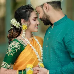 A close-up, intimate portrait of a Maharashtrian couple. The soft light and gentle expressions make this a timeless and romantic shot.