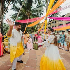 Making an entrance with a bang! The couple's entry was a high-energy affair with colorful smoke bombs and the infectious beats of dhol players, setting the tone for a fun-filled Haldi.