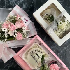 A look at two of my popular hamper styles. One features a pink theme with a "Happy Birthday" bento cake and roses, while the other is a classic white box with a "With Love" cake.