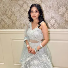 A side profile of the client, showing her beautiful wavy hair.