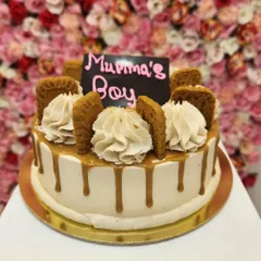 A special Lotus Biscoff cake for a "Mamma's Boy". This cake features a caramel drip, creamy frosting, and is decorated with whole Lotus Biscoff biscuits. It's a perfect blend of sweet, spiced, and creamy flavors.