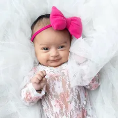 A beautiful, happy smile from an awake newborn. It takes patience, but capturing these expressions is incredibly rewarding.