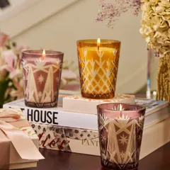 The Royal Ember candles bring a soft, radiant glow to any space. Crafted in intricately cut glass, this elegant duo is available in two ethereal colors: a sensuous Blush and a celebratory Gold. They are perfect for festive gatherings or as a luxurious home decor accent.