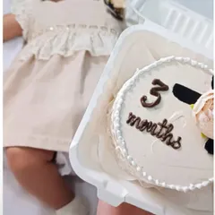 Celebrating a baby's three-month milestone with a custom bento cake. It's a sweet way to capture these fleeting moments.