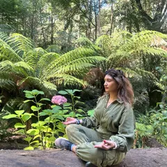 Meditating in a lush forest in Australia. Taking time to sit in nature, connect with my breath, and feel the 'Om' within is essential to my practice.
