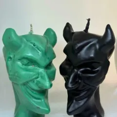 Dare to light the darkness. Our Devil Head Candle is not just a flame, it’s a statement. This pair, in green and black, is for those who love a touch of mystery and power.