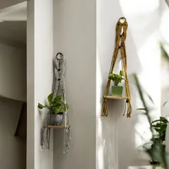 My wall planter shelves are perfect for adding greenery to your walls. Here you can see two different styles, one with a simple knotted design and another with a more intricate pattern, showing the range of customization available.