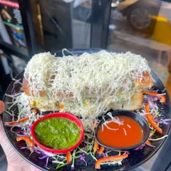 My Mumbai Bites Italian Sandwich is a meal in itself. It's a massive, triple-layered sandwich packed with fresh veggies and sauces, then grilled and loaded with a generous amount of cheese.