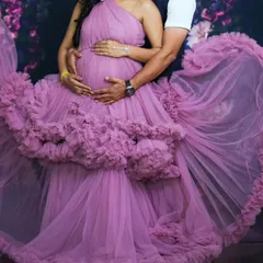 This one-shoulder ruffle gown in a lovely pastel pink is perfect for a dreamy maternity shoot. We have a wide range of pastel shades available in our store.
