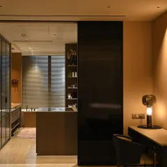 Automation extends to every corner of the home, including this elegant walk-in closet and bathroom area. We ensure every detail, from lighting to security sensors, is perfectly integrated for effortless comfort and modern luxury.