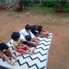 Children practicing yoga together in our outdoor space. Starting these healthy habits early helps them develop flexibility, strength, and a connection between mind and body.