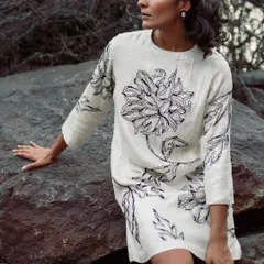 For this creative shoot, I styled a white linen dress with bold, black floral embroidery. The natural, rocky backdrop provides a beautiful contrast to the delicate sequin work, creating an earthy yet glamorous image.