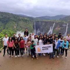 The whole tribe gathered at Jog Falls, with the Adventure Buddha banner. It's a great way to kick off a coastal adventure.
