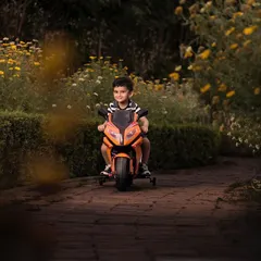 Capturing the pure joy of movement and play. This little boy is having the time of his life on his toy motorcycle during an outdoor session. The natural setting and his happy expression make for a perfect action shot.
