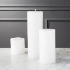 Three of my classic white pillar candles in small, medium, and tall sizes. Their clean lines and smooth finish make them a versatile choice for any decor style, from minimalist to grand.