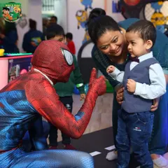 A gentle moment between a superhero and a young fan. Our character entertainers are great with children and know how to make every child feel special.