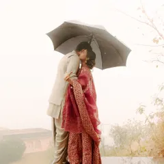 Unplanned moments are often the most precious. When the rain came, these two didn't run from it. They embraced it, and in that simple act of sharing an umbrella, they created a memory of pure, unscripted romance. I focus on capturing the heart of your story, even when nature has its own plans.