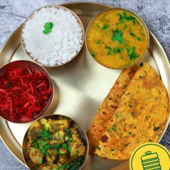A classic North Indian thali featuring flavourful aloo sabzi, thepla, vibrant beetroot salad, steamed rice, and comforting dal. This is what a simple, satisfying home-cooked meal looks like.
