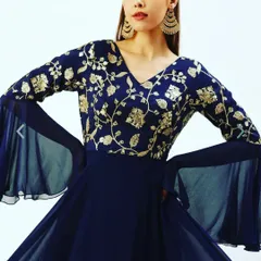 For a more formal event, I offer this elegant navy blue one-piece gown. It features delicate gold floral embroidery on the bodice and dramatic georgette bell sleeves, giving you a sophisticated look without the hassle of managing a separate dupatta.