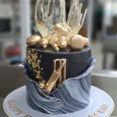 For the Master Blaster, Sachin Tendulkar, I designed this special cricket themed birthday cake. It features a black and grey marbled tier, edible gold leaf, and a sculpted sugar cricket bat and wickets, making it a truly personal and celebratory piece.