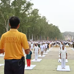 Our instructor leads a massive outdoor yoga session in Hoshiarpur for International Yoga Day. It is always an honor to guide so many people in their practice and share the unifying power of yoga.