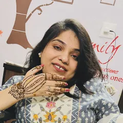 A happy client showing off her simple yet beautiful mehndi. This kind of design is perfect for guests who want something pretty without full coverage.