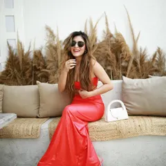 A candid, joyful moment from the same shoot, capturing the model's natural smile. Authentic shots like this perform well on social media.