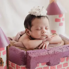 A close-up of our little princess, sleeping peacefully in her castle. The tiny crown is the perfect finishing touch.
