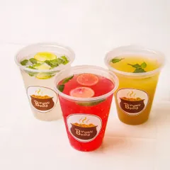 A vibrant trio of Indian summer coolers: kokum, masala lemonade, and aam panna, showcasing a range of beverage options.