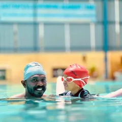 A happy moment from our infant batch. Our coaches are experts at making our littlest swimmers feel secure and joyful as they explore the water, often with the help of flotation aids.