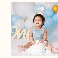 The smile of a one-year-old who knows he's about to get his hands on some cake! I make sure to capture these moments of sweet anticipation right before the smashing fun begins.