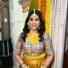 The perfect Haldi glow. This look is all about fresh, luminous skin and bright eyes, paired with a fun, whimsical hairstyle decorated with butterflies.