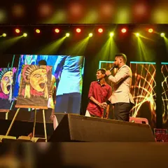 After a performance, I often get to share the story behind the art. Here I am on stage with the host, discussing the Kantara piece and the cultural inspiration behind it.