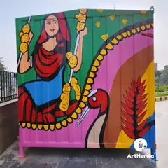 Another side of the painted container, this one featuring a woman on a swing with a bird, rendered in a vibrant, folk-art style. Each side tells a different story.