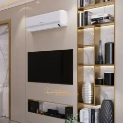 This custom media unit combines open and closed storage, with illuminated shelves perfect for displaying books and decor. The brass-finished frame adds a touch of luxury.