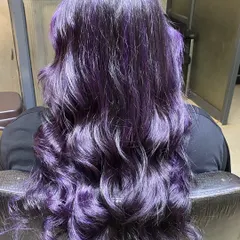 This vibrant purple balayage shows how we turn hair into a work of art. We use high-quality L'Oréal colors to create custom looks that are both bold and beautiful, styled into soft waves to show off the dimension.